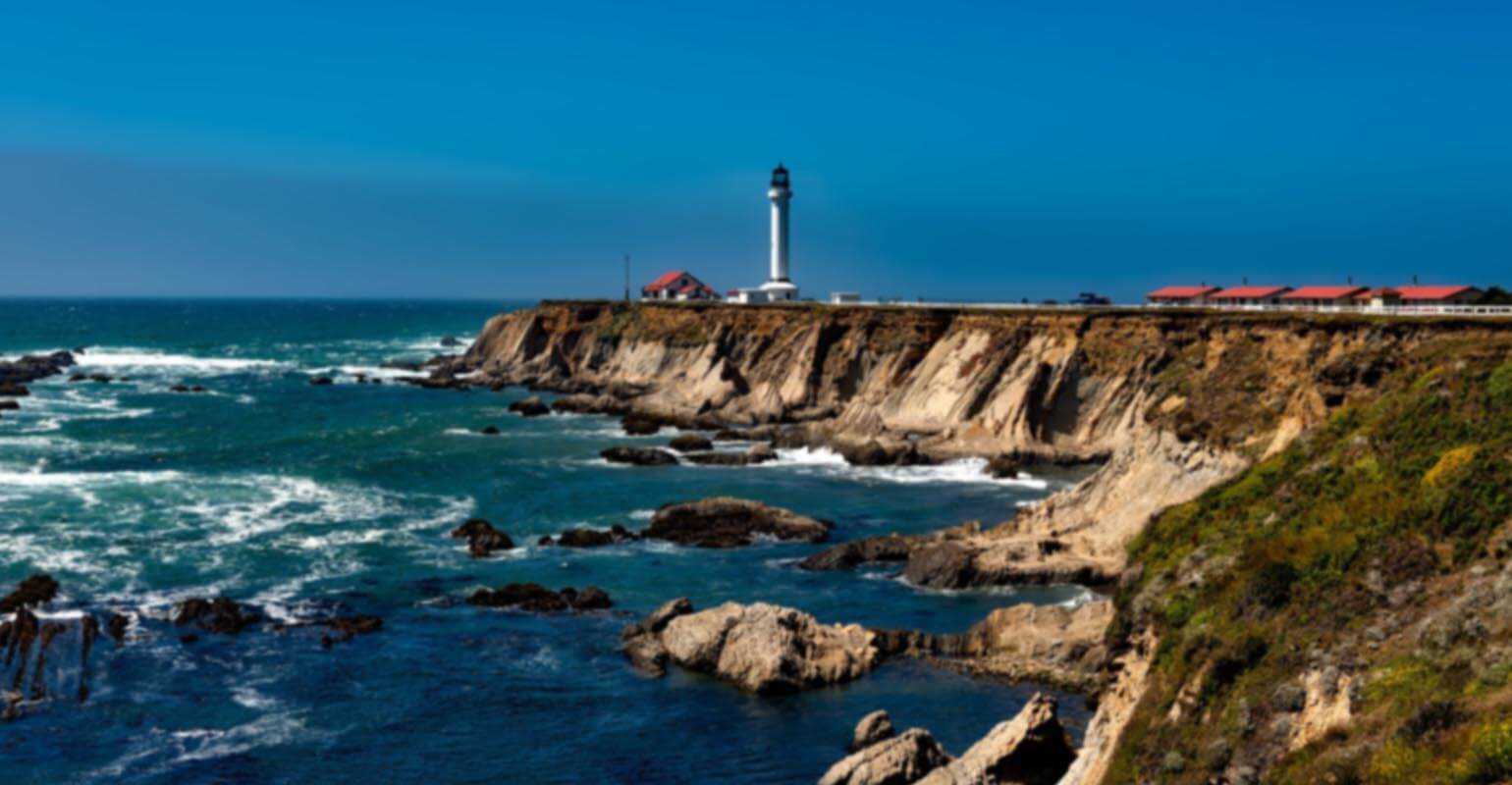 Blurry seaside lighthouse landscape image